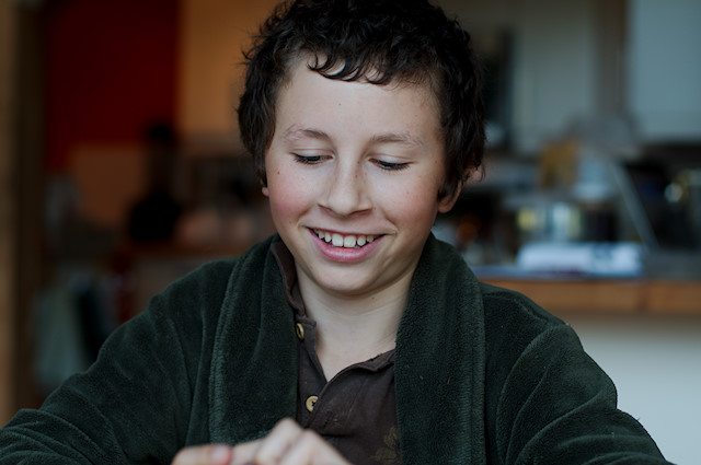 boy smiling with cards