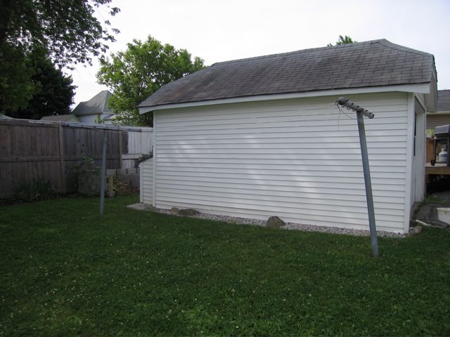 Garage with Rock edge: I just finished putting a rock edging along the garage this spring.  Last year we dug up and reseeded the grass.  This fall I want to finish painting the fence.