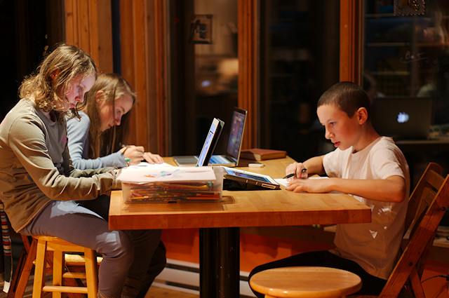 kids drawing at table