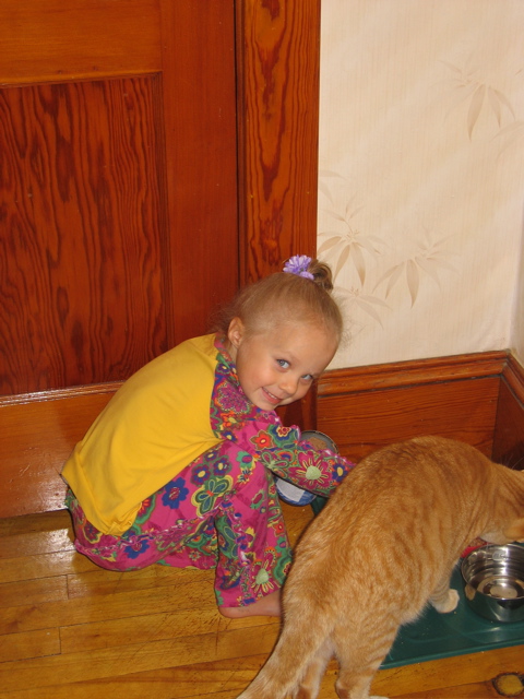 Brienne feeding cat