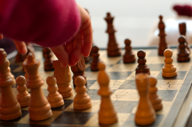 kiddos playing chess at a local cafe