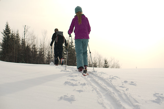 cresting hill on skis