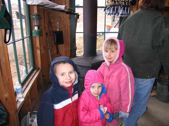 Maine Maple Sunday kids at woodstove